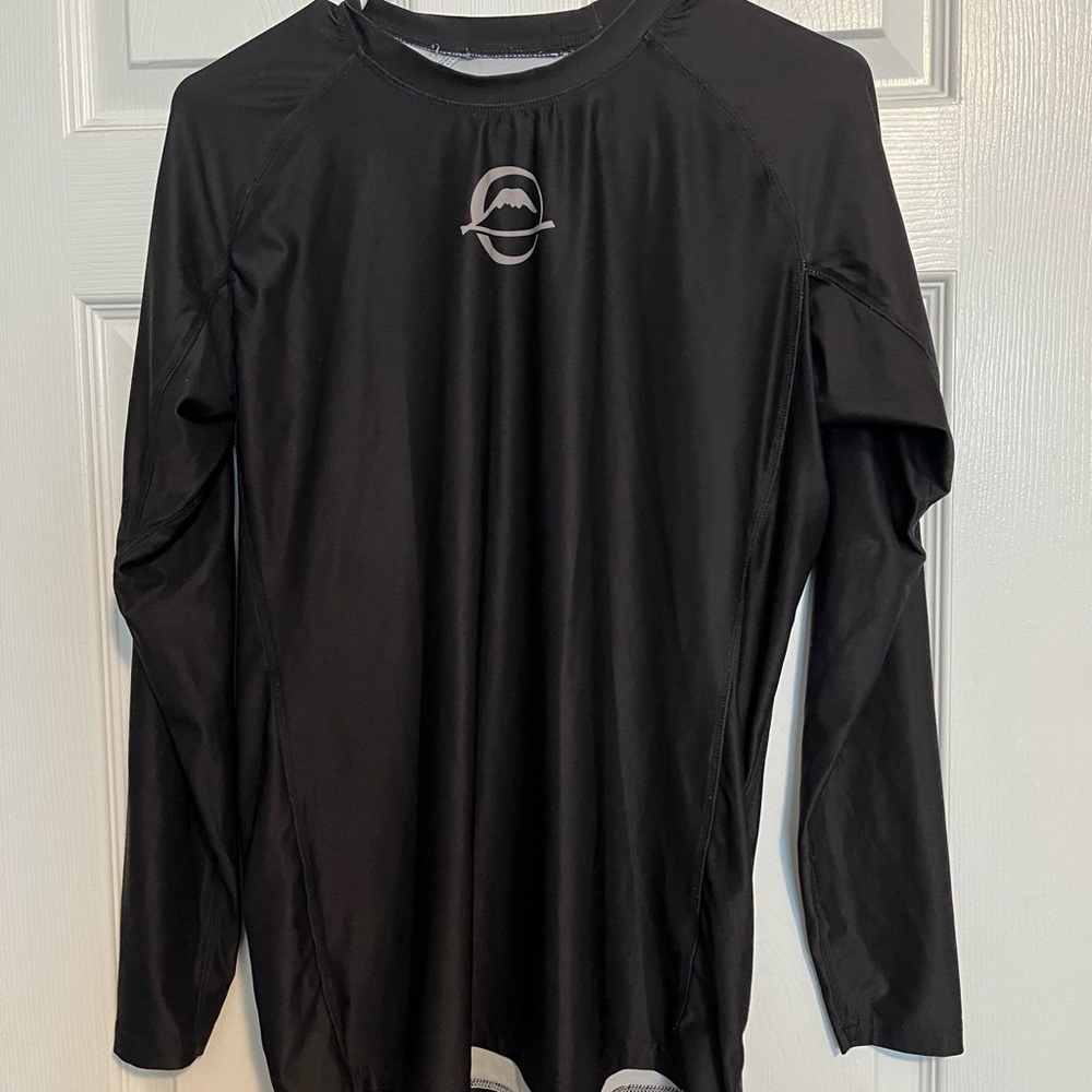 Assorted jujitsu rash guards